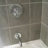This bathroom remodel required tile, fixture, and tub install work.