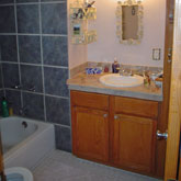 Photo showing a shower installation and floor tiling work in Summit County, Colorado.