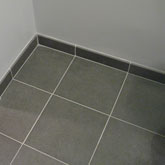 Floor and bullnose tilework in Frisco bathroom.
